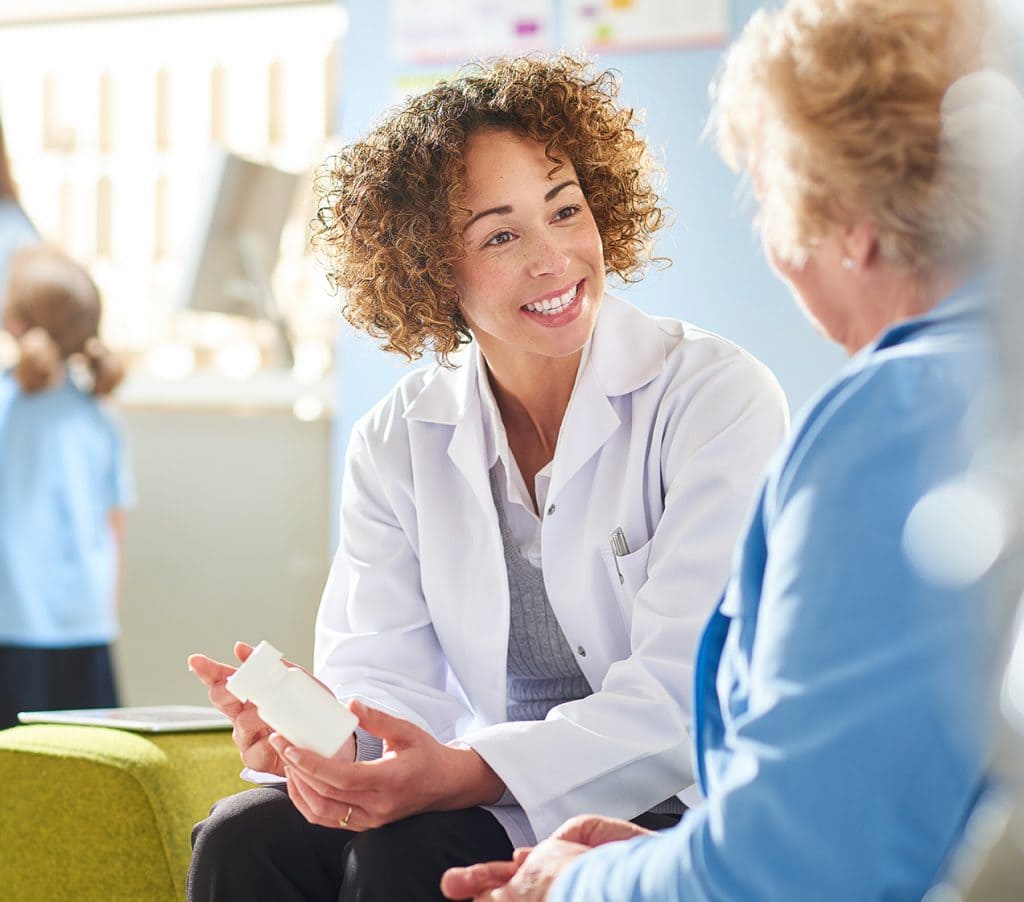 pharmacist talking to patient