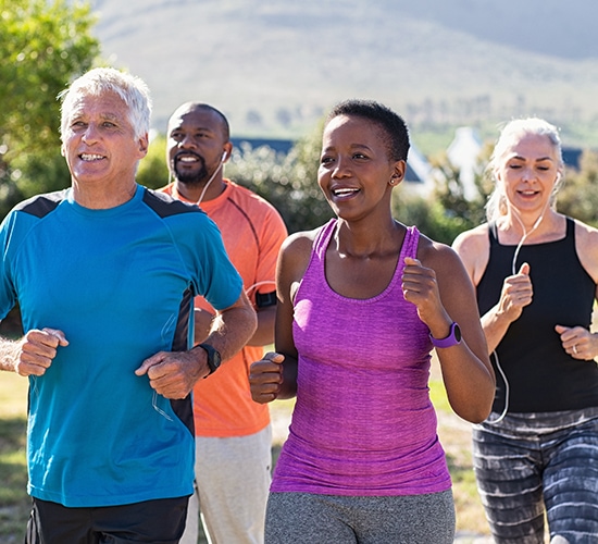 diverse group of people running