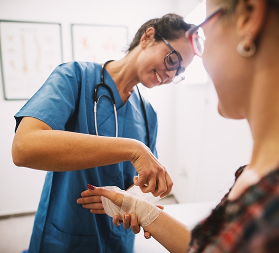 nurse wrapping a patient's wrist