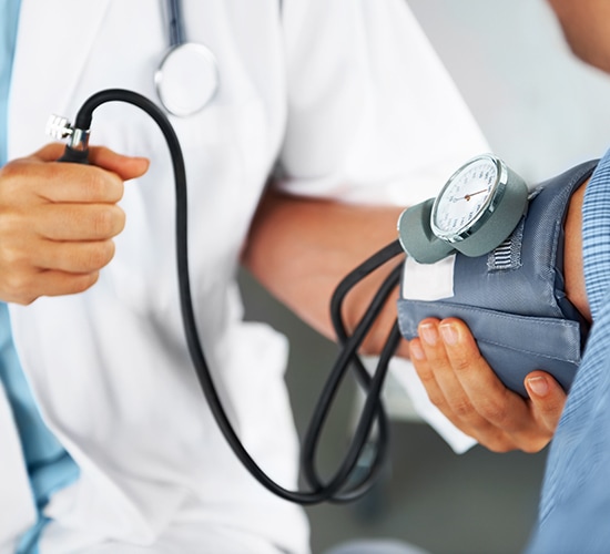 pharmacist performing blood pressure test