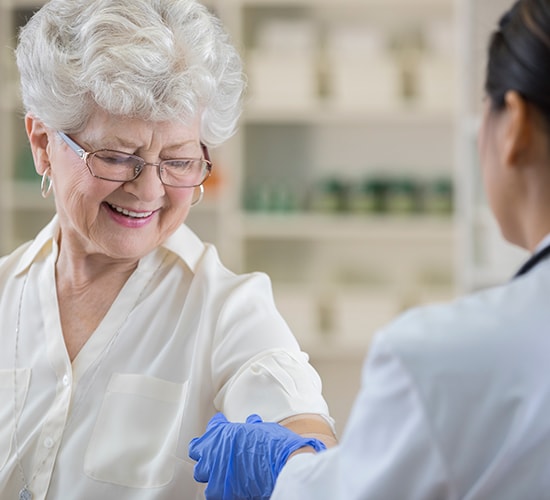 senior receiving a vaccination