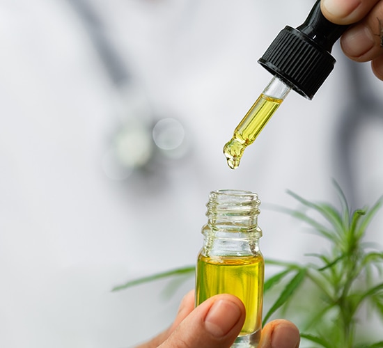 cbd oil dripped into small bottle